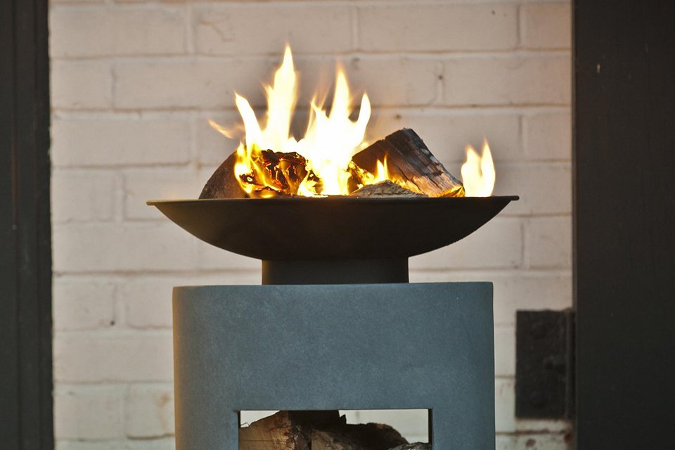 An Ivyline cement fire pit and oval console.